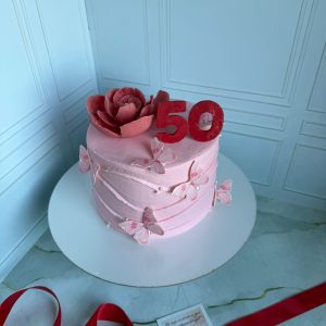 Торт на юбилей 50 лет «Рафаэлло-маракуйя» с цветком и бабочками