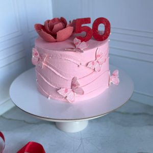 Торт на юбилей 50 лет «Рафаэлло-маракуйя» с цветком и бабочками